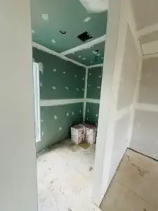 Bathroom in a home addition, moisture-resistant drywall installed