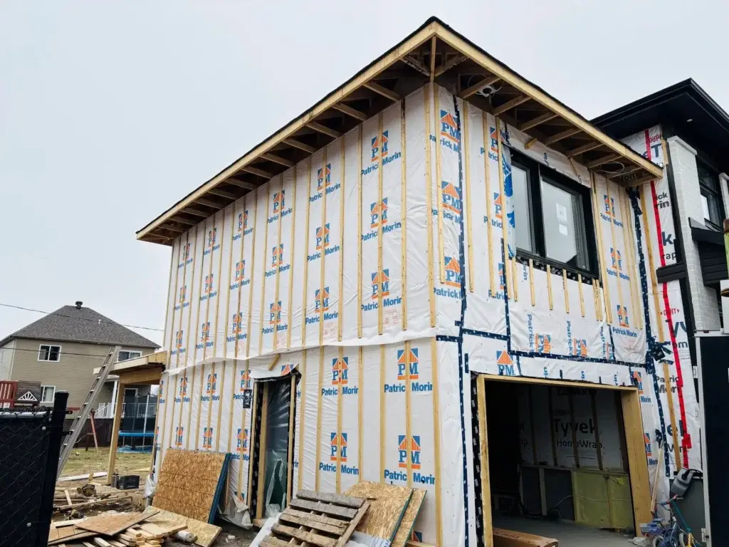 Home addition under construction, framing and air barrier installed
