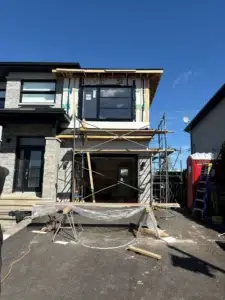 Second-storey addition over a garage during construction